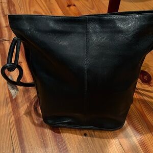 Large Bucket style bag,14x15” zip closure , inside zip pocket, 28” strap